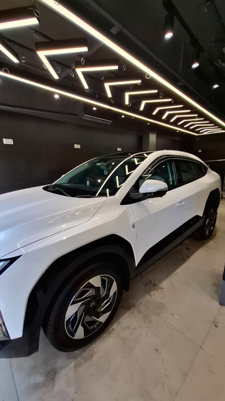 White vehicle side profile suited for sun control film and window visibility